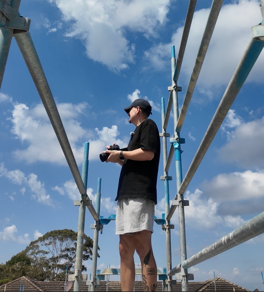 Adam filming on a job site